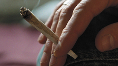 Close-up smoke marijuana fingers