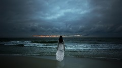 Clouds ocean reflections brunettes long dress