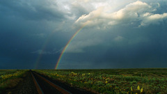Clouds rainbows railroad tracks