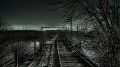 Dark night railroad tracks
