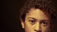 Dreads faces brown background