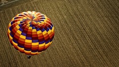Fields multicolor bird's-eye view hot air balloons