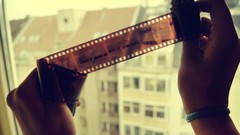 Film hands negative cityscapes