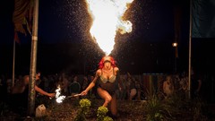Fire woman crowd flames pink hair bikini fire-breathing oil 