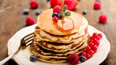 Food blueberries plates pancakes fruits raspberries forks wood 