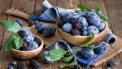 food fruit blackberries bowls wooden surface blueberries Berries