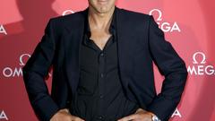 George Clooney watches man