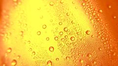 Glass orange water drops