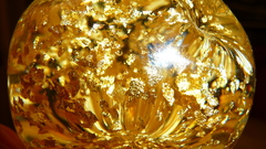 Gold flakes suspended in