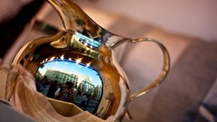 Gold tea vase reflections