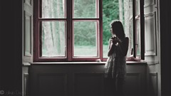 Gray woman frosty toned window panes