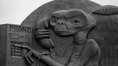 Grayscale E.T. sand sculptures