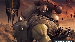 Human sawing orc just