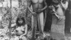 Hut front family Brazil indian posed