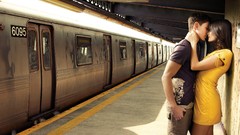 Kissing train stations couple