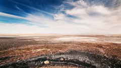 Landscapes nature black blue clouds white plain brown rocks 