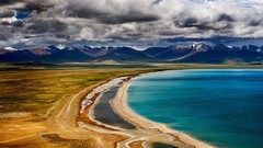 Landscapes nature yellow gray water blue Mountains clouds Tibet 