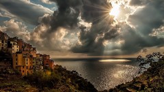 Landscapes Sea nature yellow sun clouds dark hills ravine 