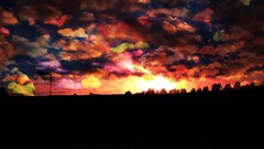 Landscapes sunset black clouds light orange colors sundown 