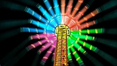 Lights spin blurred multicolor ferris wheels