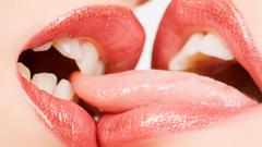 Lips kissing tongue biting