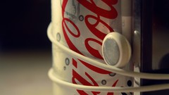 Macro coca-cola earphones soda cans