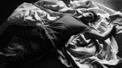 Men grayscale lying down