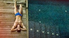 Men lying down swimming pools male models poolside