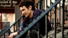 Men railing Actors sitting smiling james franco curly hair 