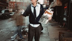 Men tie newspapers hats Johnny Knoxville