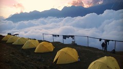 Mountains clouds tents camping