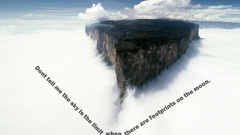 Mountains clouds text cliffs