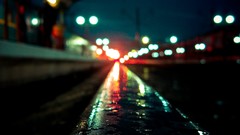 Night rain Station bokeh railroad tracks worms eye view