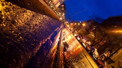 Night rain tram reflections water drops budapest streets 