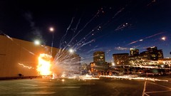 Night white lights smoke explosions boom fireworks TV shows 