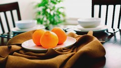 Oranges plates Tables fruits napkins blurred background