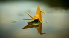 origami paper cranes reflection water