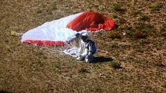 Parachute landing Red Bull ground Felix Baumgartner kneeling 