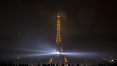 Paris Eiffel Tower night spotlights France dark lights cityscape