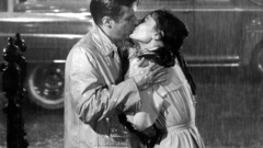 Rain kissing Audrey Hepburn