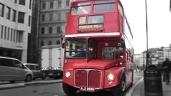 Red black and white London England tower bus double-decker bus