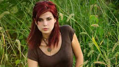 Red woman Christine models hair in face