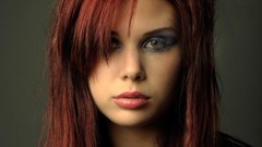 Red woman Christine models hair in face