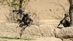 Sand jump War Guns dust fight soldiers military patrol Finland 