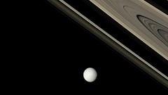 Saturn rings planets outer space moons Tethys