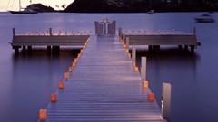 Sea fire Mountains ocean chairs dusk Boats evening Candles 