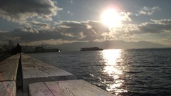 Sea sun clouds steamship Izmir sunay