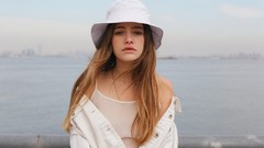 Sea water ocean woman hats urban shoulders long hair green eyes 