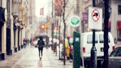 Snow blurred vehicles cityscapes streetscape street signs
