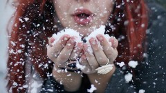 Snow woman models redheads blowing a kiss